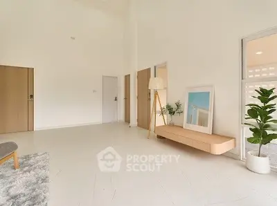 Spacious modern living room with minimalist decor and natural light