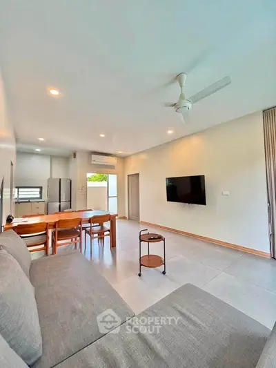 Spacious modern living room with open layout and sleek furniture