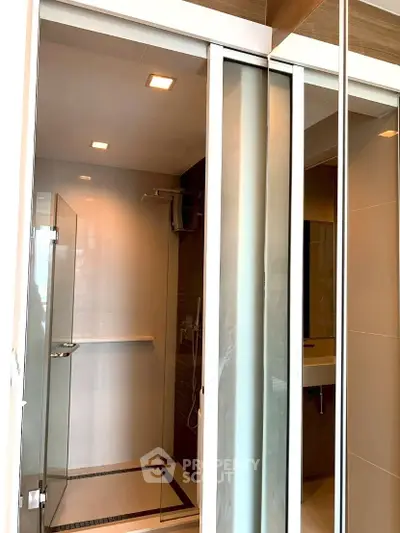 Modern bathroom with glass shower enclosure and sleek design