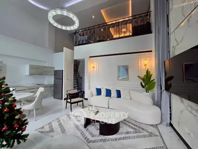 Luxurious modern living room with high ceilings, elegant chandelier, and stylish decor