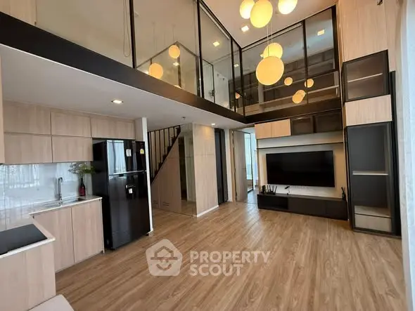 Modern loft-style living room with high ceilings and elegant lighting