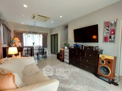 Spacious living room with modern decor and entertainment setup