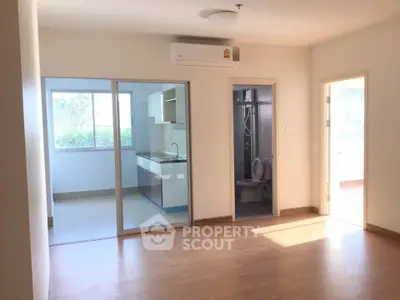 Spacious apartment with open layout, featuring a modern kitchen and bright living area.