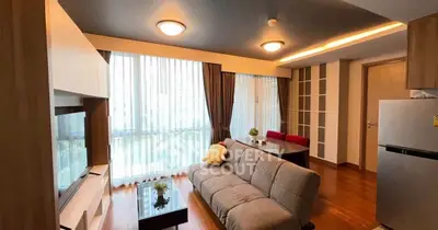 Modern living room with large windows and stylish furniture