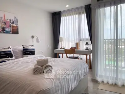 Modern bedroom with city view, featuring cozy bed and stylish decor, perfect for urban living.