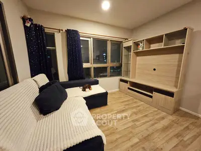 Cozy living room with modern sectional sofa and wooden entertainment unit