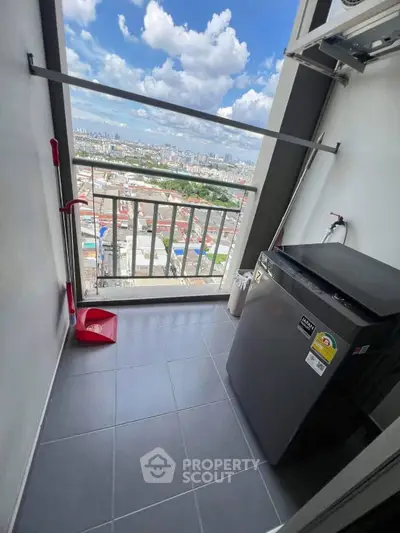 High-rise balcony with city view and modern washing machine setup