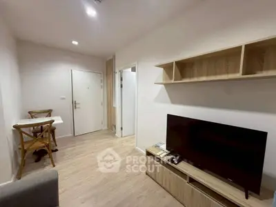 Modern living room with wooden flooring and minimalist furniture