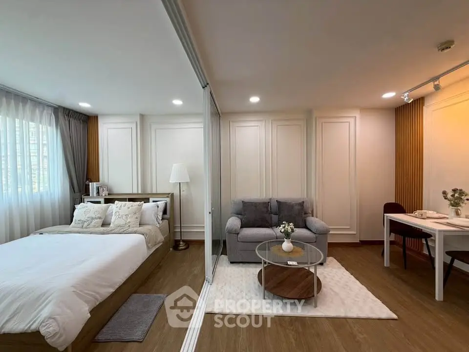 Modern studio apartment with cozy living area and elegant decor