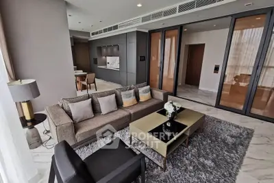 Luxurious modern living room with elegant decor and open kitchen layout in high-end apartment.