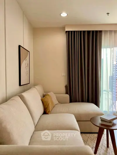 Stylish living room with modern beige sofa and elegant decor