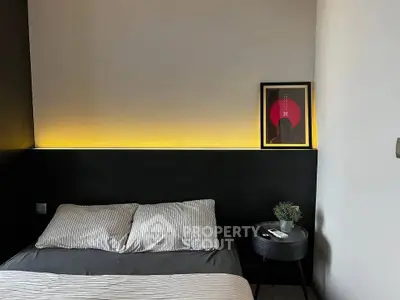 Modern bedroom with stylish decor and ambient lighting