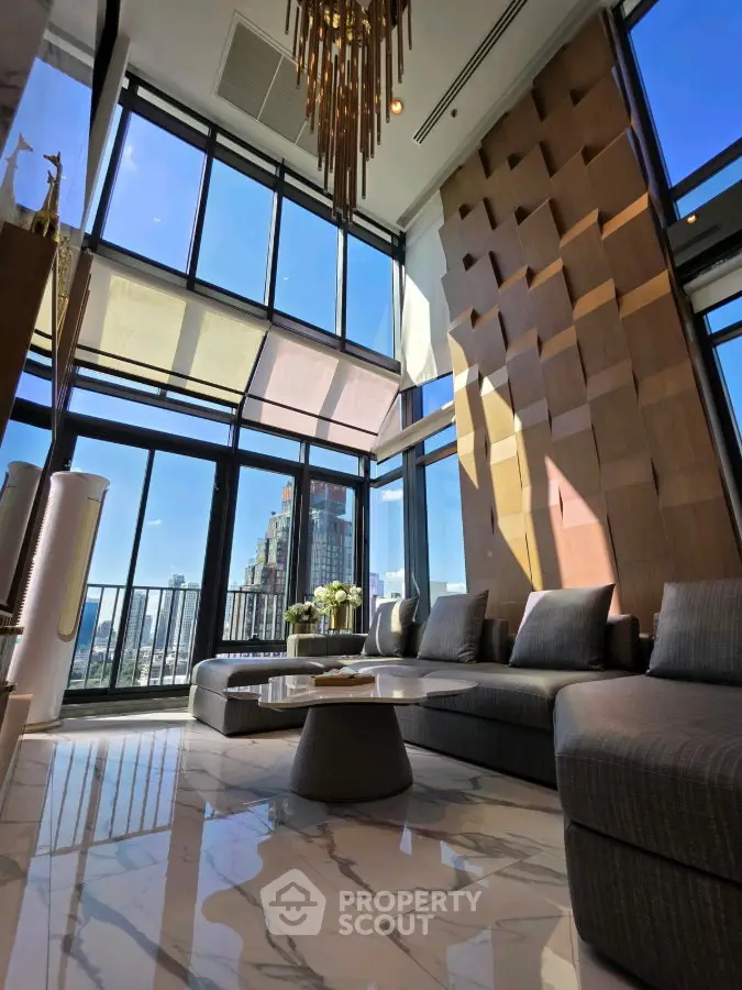 Luxurious high-rise living room with floor-to-ceiling windows and stunning city views.
