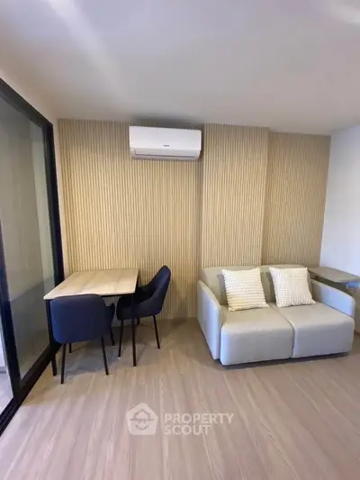 Modern living room with stylish furniture and air conditioning