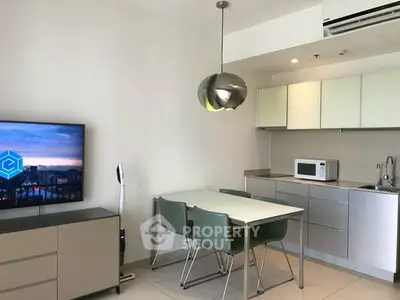 Modern kitchen and dining area with sleek design and contemporary furniture.