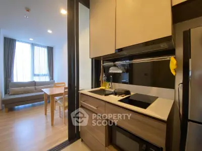 Modern kitchen with open layout and cozy dining area in stylish apartment