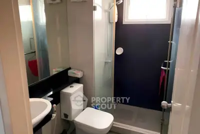 Compact modern bathroom with shower and sleek fixtures