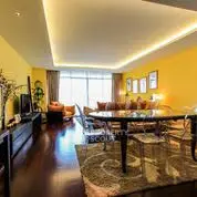 Spacious living room with modern decor and ambient lighting