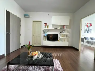 Modern living room with stylish decor and wooden flooring