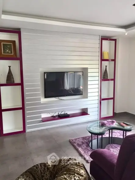 Stylish living room with modern TV unit and vibrant decor