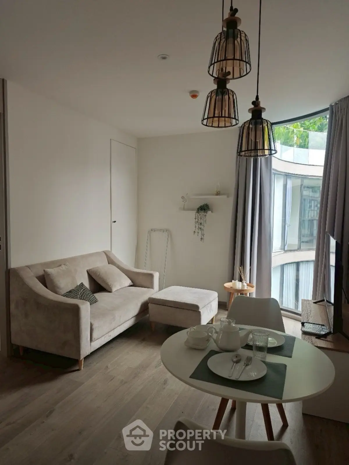 Cozy living room with modern decor and large window view