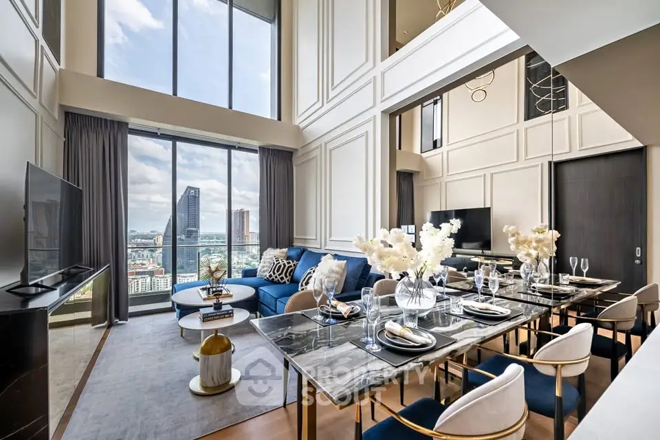 Luxurious high-rise living room with stunning city view, elegant decor, and spacious dining area.