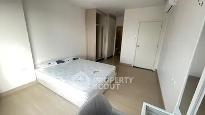 Spacious bedroom with modern design and ample storage space
