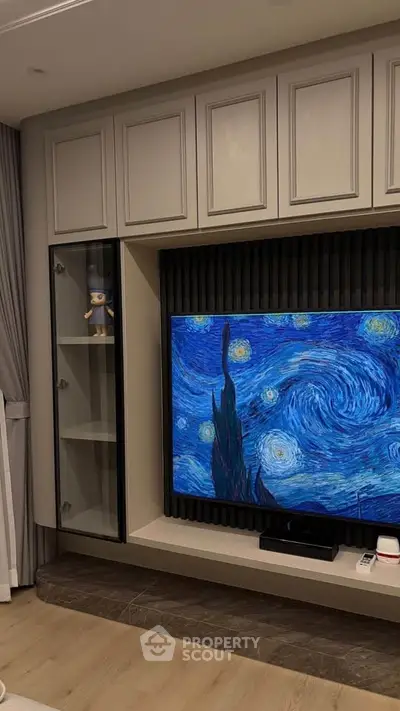 Modern living room with stylish TV setup and elegant cabinetry