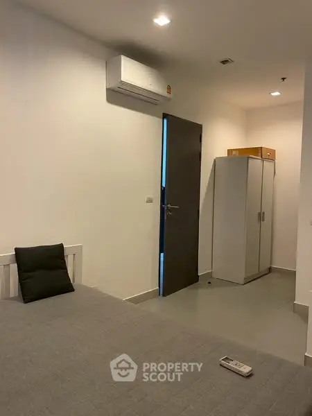 Modern bedroom with air conditioning and minimalist decor