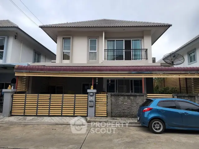 Charming two-story house with modern facade and driveway parking in a suburban neighborhood.