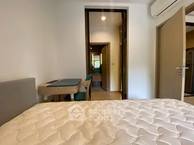 Cozy bedroom with modern furniture and air conditioning, perfect for comfort and relaxation.