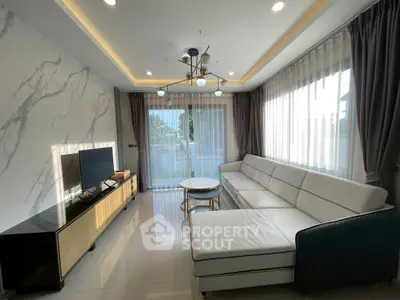 Modern living room with elegant marble wall and large sectional sofa