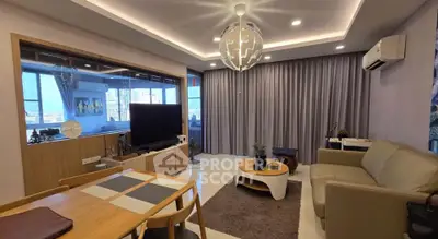 Modern living room with stylish decor and city view, featuring a cozy seating area and elegant lighting.