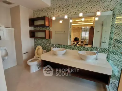 Luxurious modern bathroom with dual sinks and elegant lighting