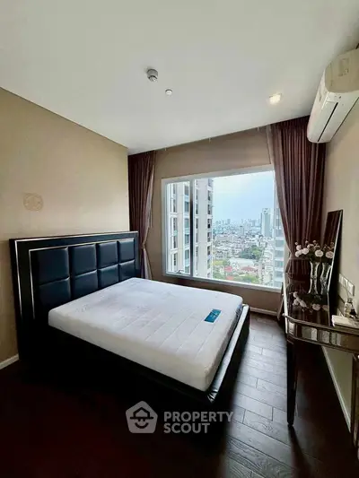 Luxurious bedroom with stunning city view and elegant decor