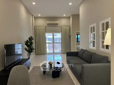 Spacious modern living room with elegant decor and natural light