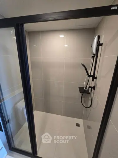 Modern bathroom with sleek shower enclosure and contemporary fixtures