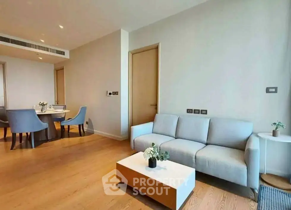Modern living room with elegant dining area and stylish furniture