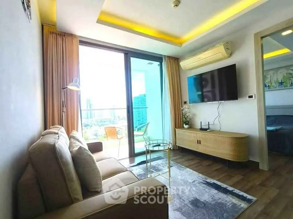 Modern living room with balcony view in high-rise apartment