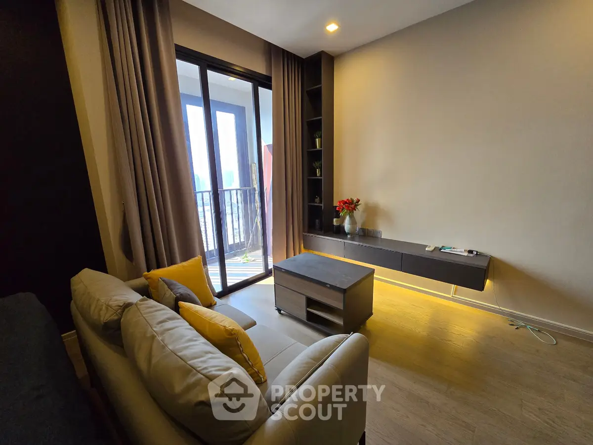 Modern living room with balcony access and stylish decor