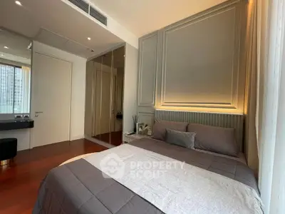 Luxurious bedroom with elegant decor and large window offering city views