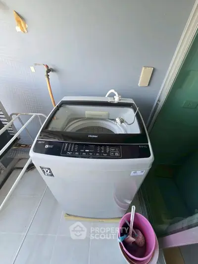 Modern washing machine on a balcony with sleek design and efficient features.