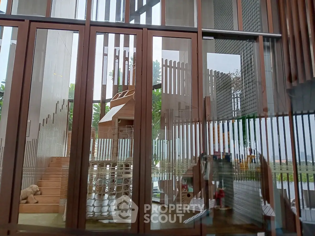 Luxurious modern living space with floor-to-ceiling windows and stylish wooden accents.
