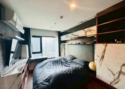 Luxurious bedroom with city view and modern design elements.