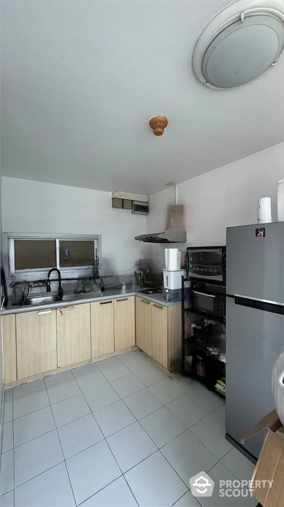 Modern kitchen with sleek appliances and ample storage space