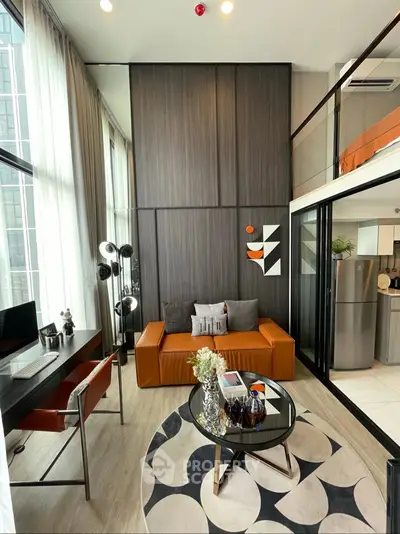 Modern loft-style living room with high ceilings and stylish decor