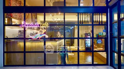 Charming cafe interior with modern glass facade and inviting ambiance