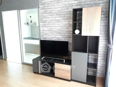 Modern living room with stylish TV stand and brick accent wall
