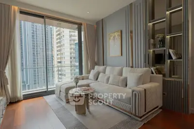 Luxurious modern living room with elegant decor and city view balcony.