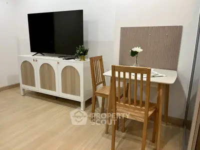 Modern living room with stylish TV stand and cozy dining area